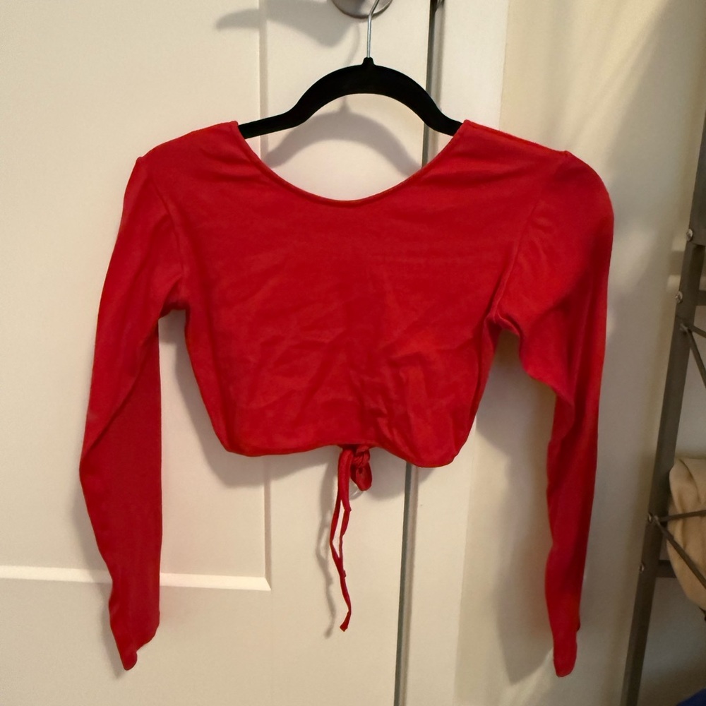 Motel size medium, red long sleeve crop top with an open back and 2 ties